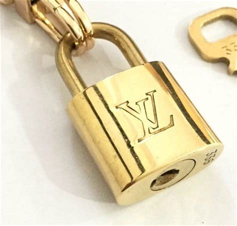 louis vuitton padlock fake|authentic louis vuitton lock.